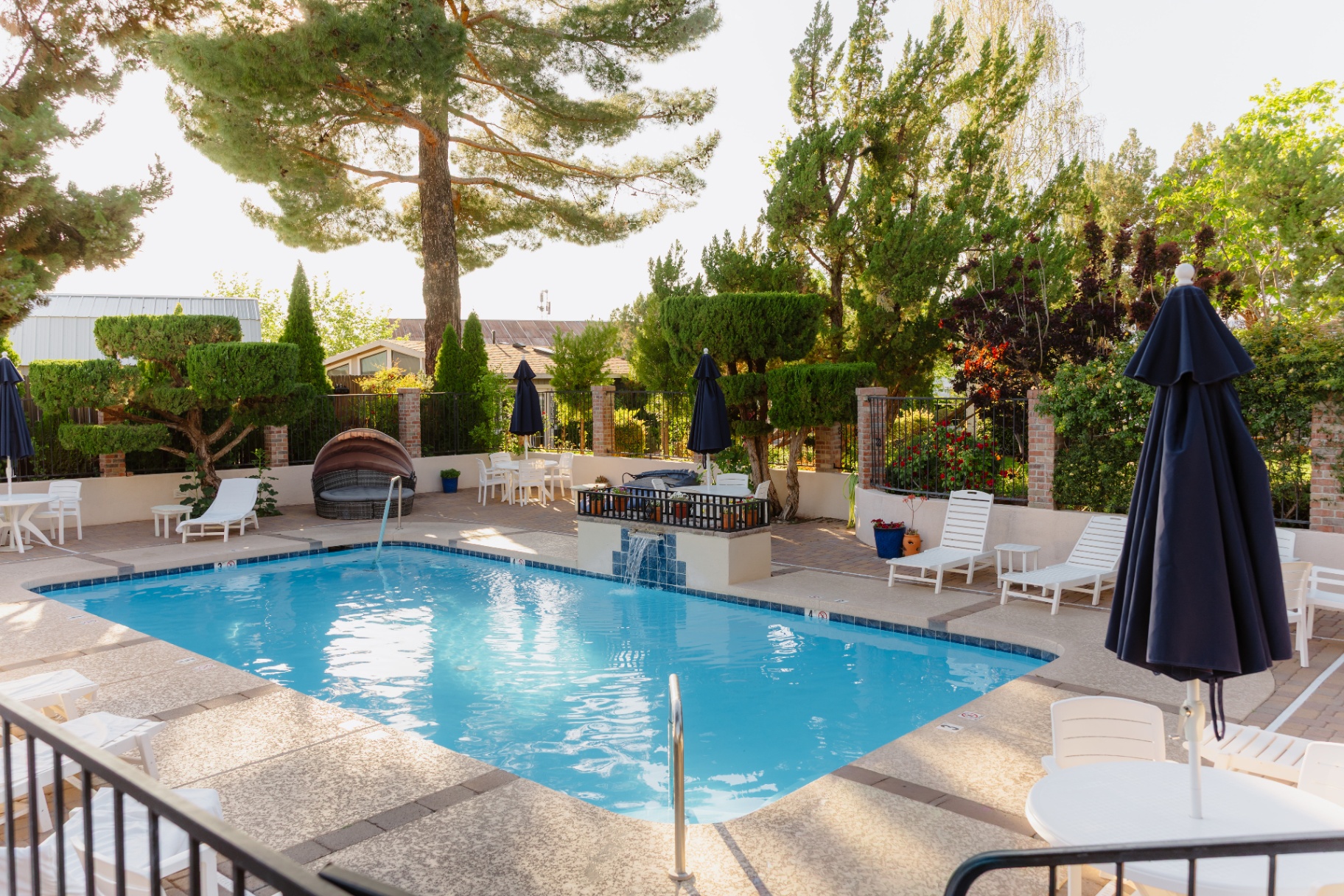 Pool deck with waterfall feature and lounge seating