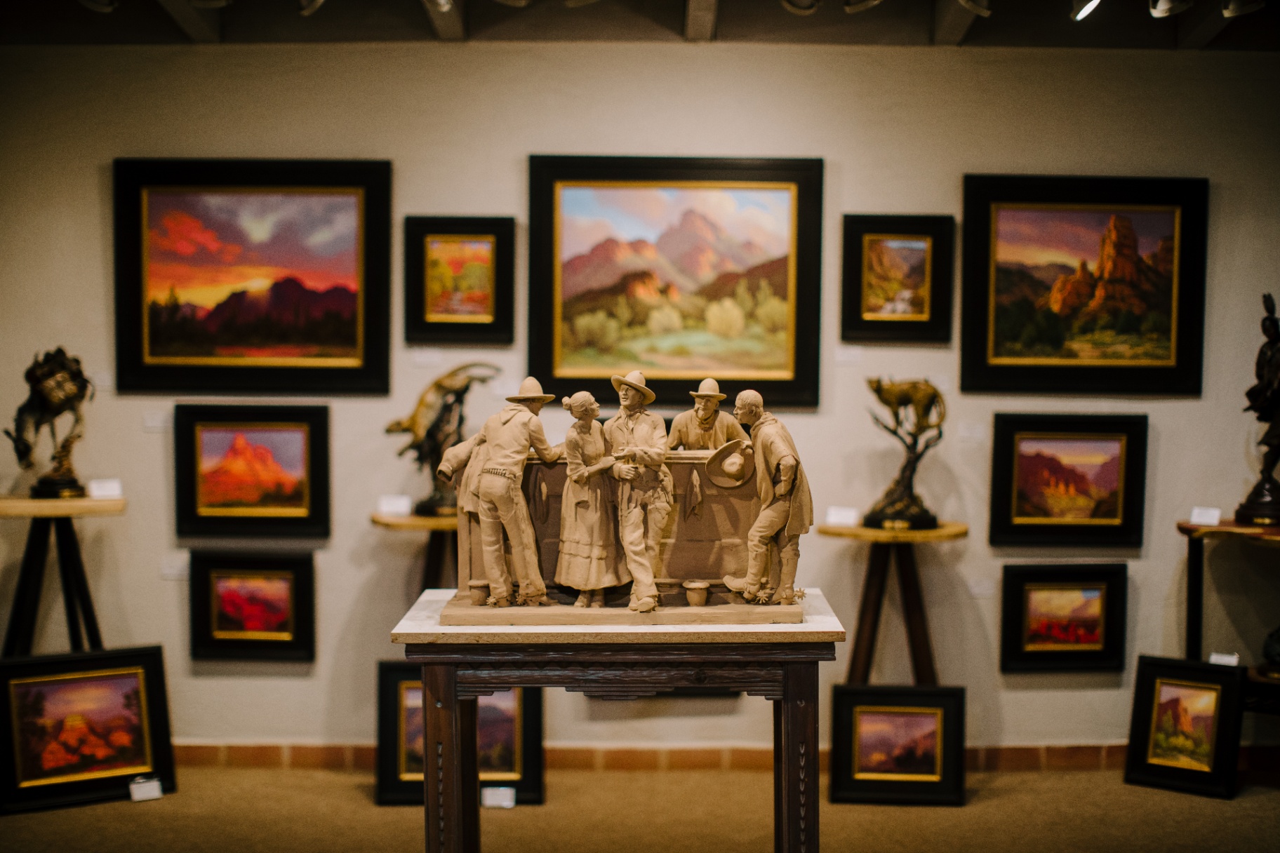 Sedona art gallery display with desert landscape paintings