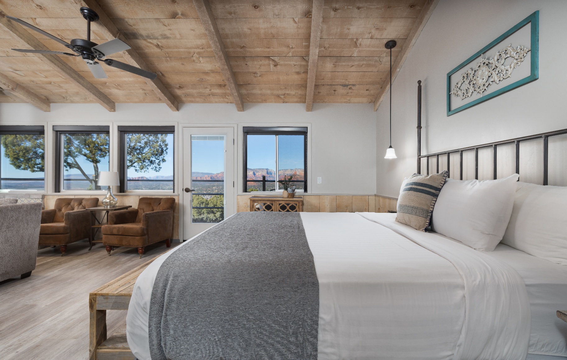 King bed facing windows with Sedona red rock views