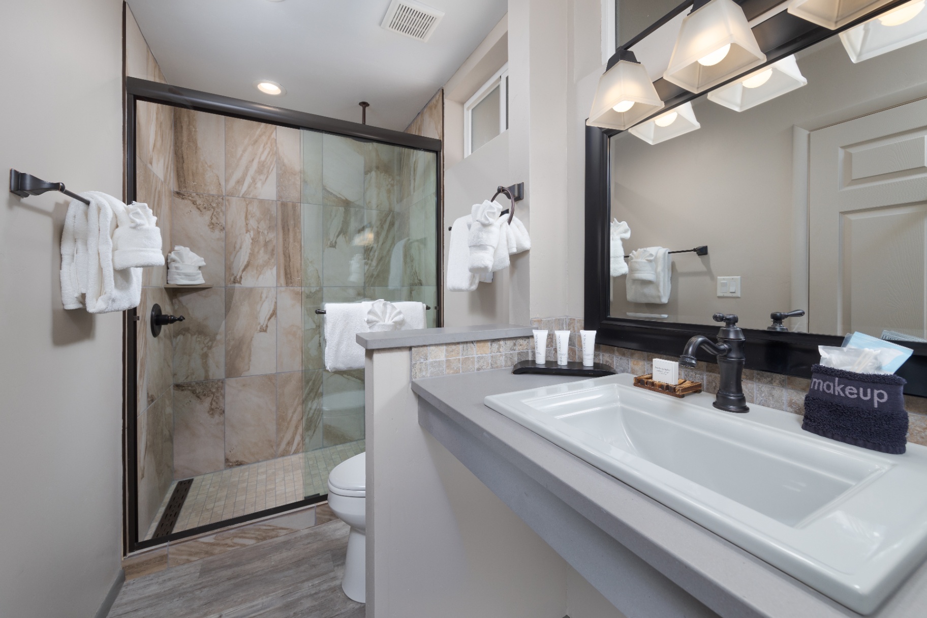 Queen cottage bathroom with glass shower and vanity
