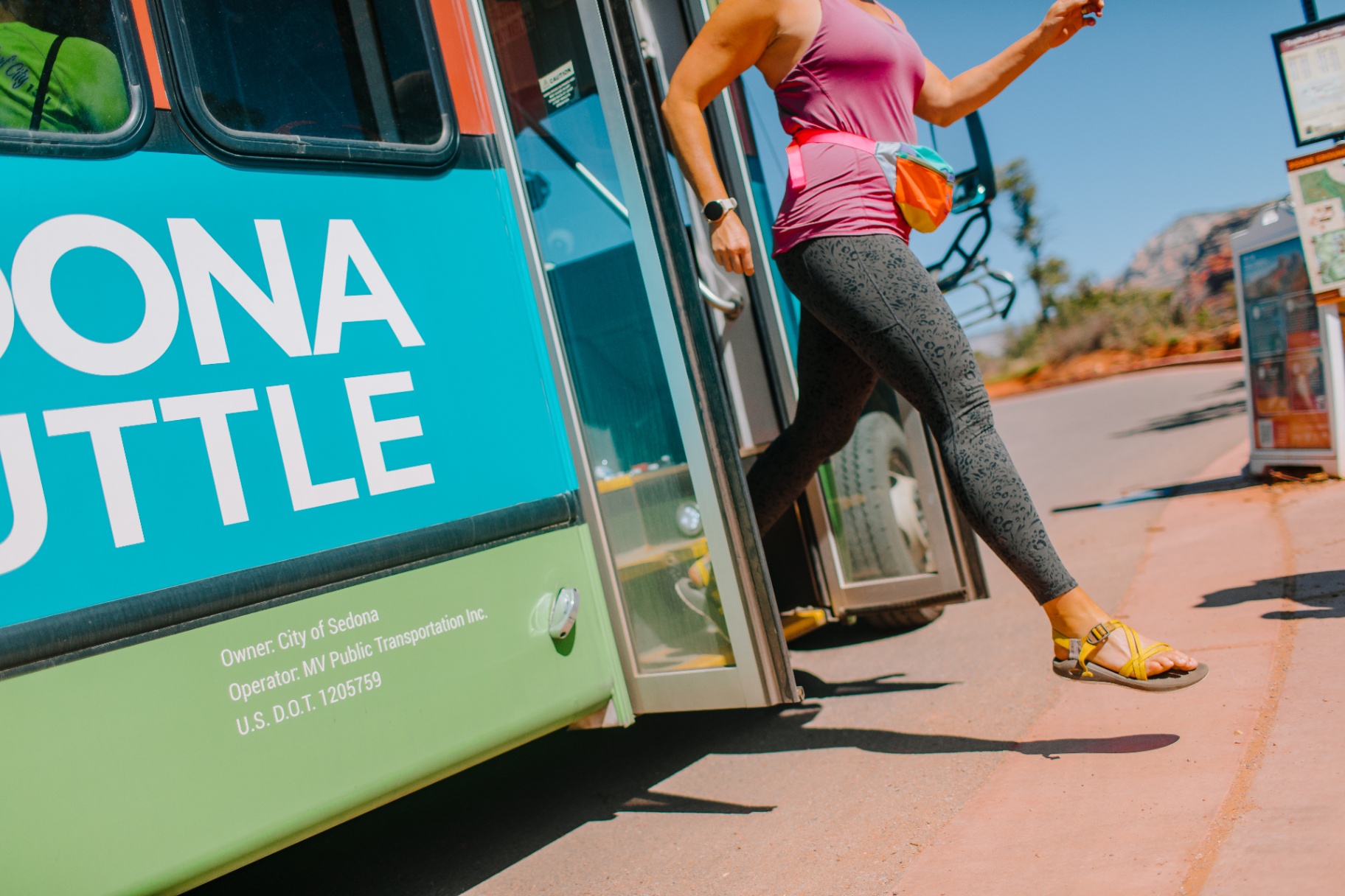 Sedona Shuttle stop with a rider stepping off the bus