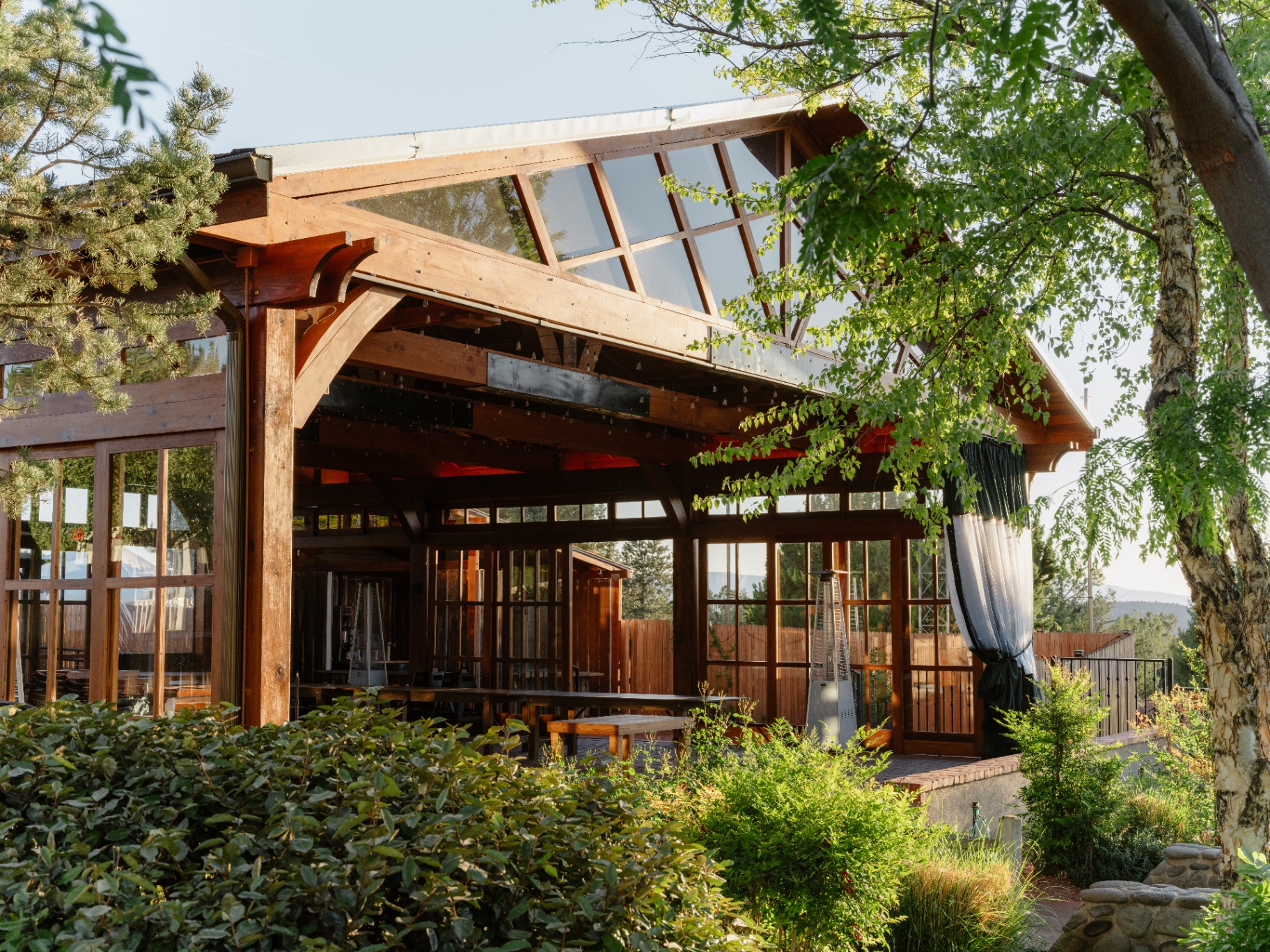 Timber-framed event pavilion among the trees