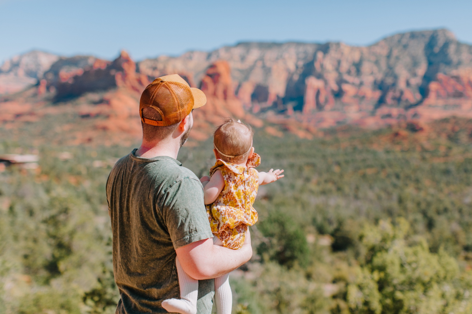 Family taking in panoramic red rock views