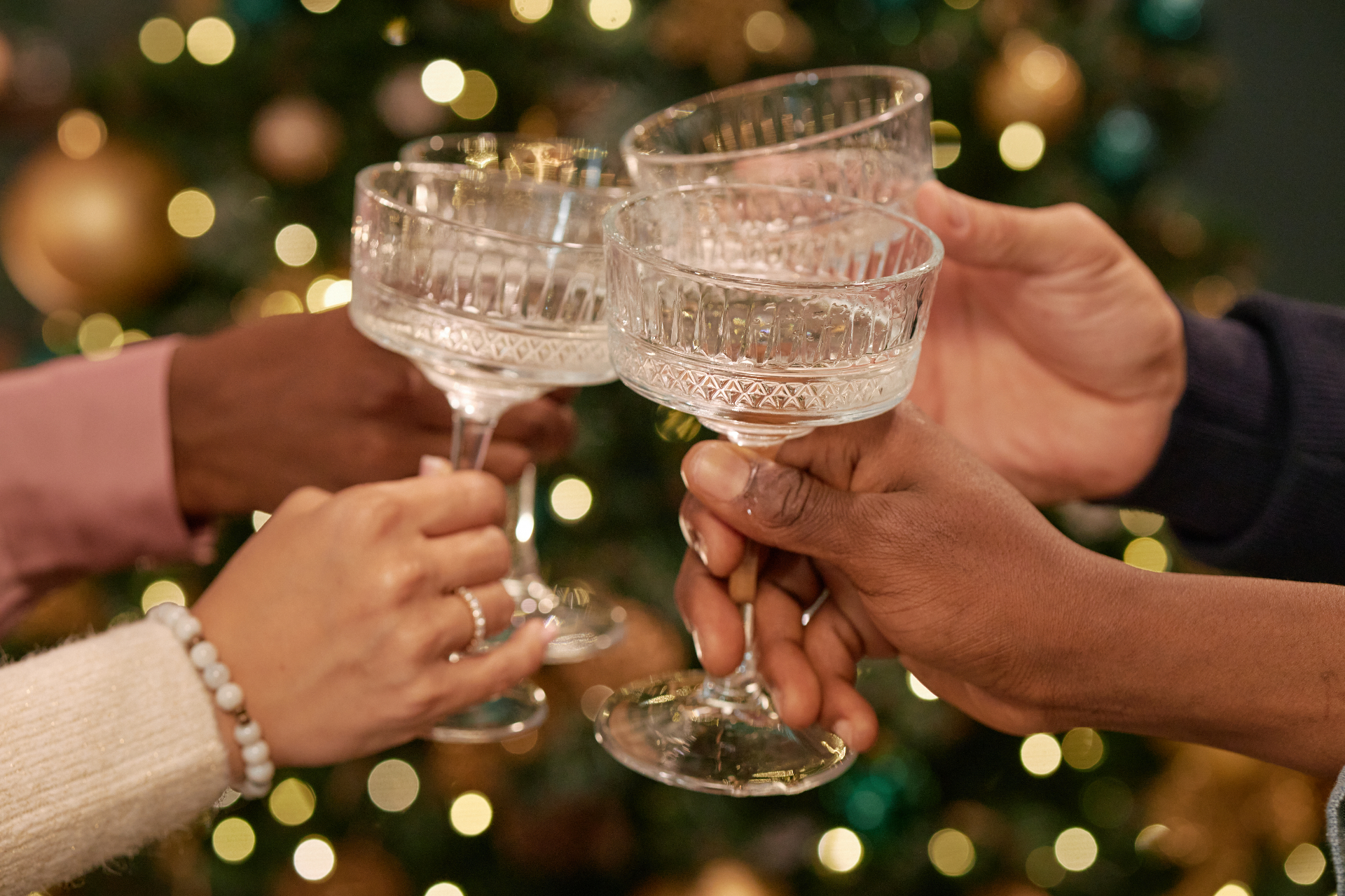 Guests toasting with champagne coupes at a Sky Ranch Lodge celebration