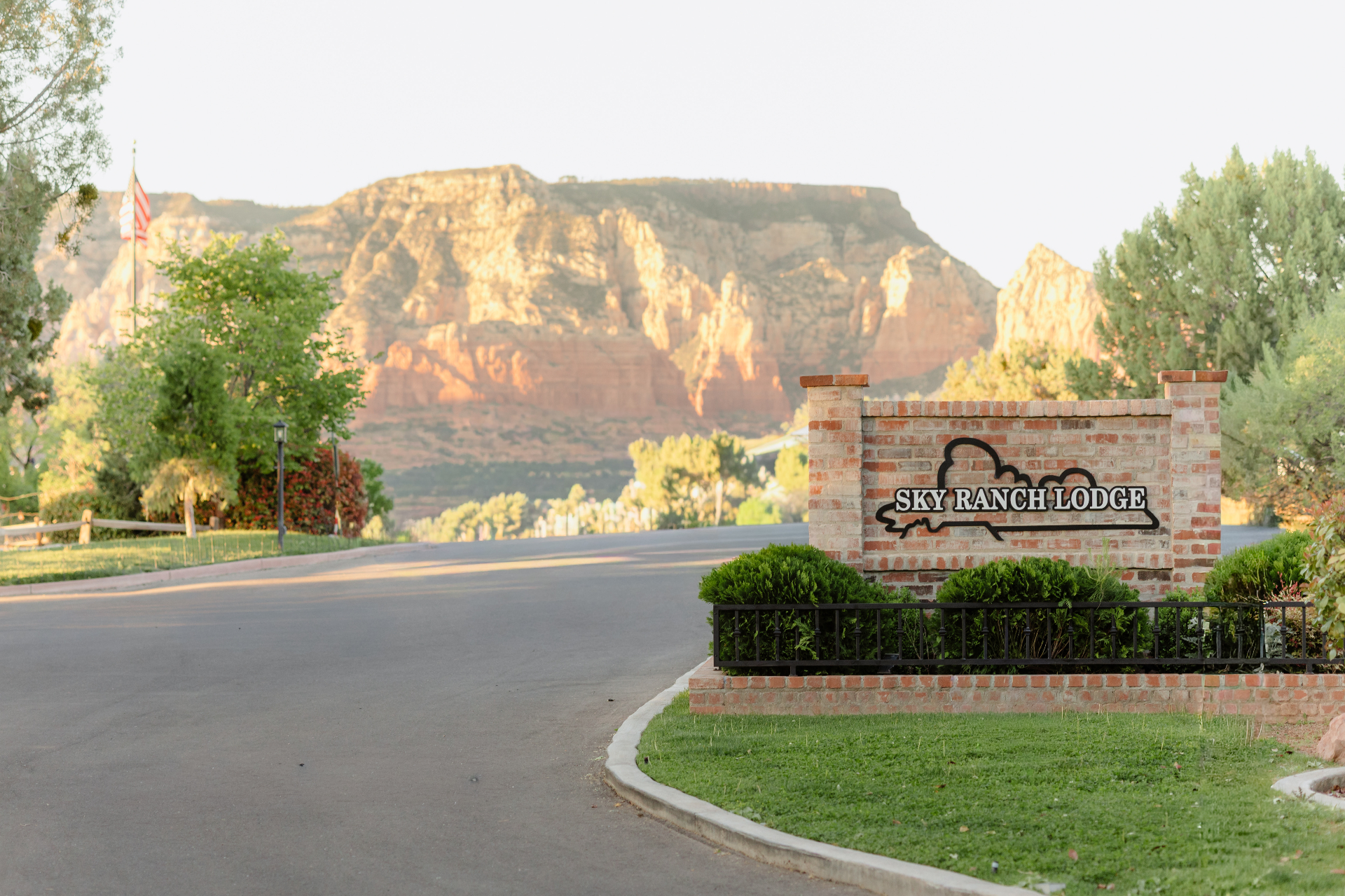 Sky Ranch Lodge entrance sign with Sedona red rocks beyond