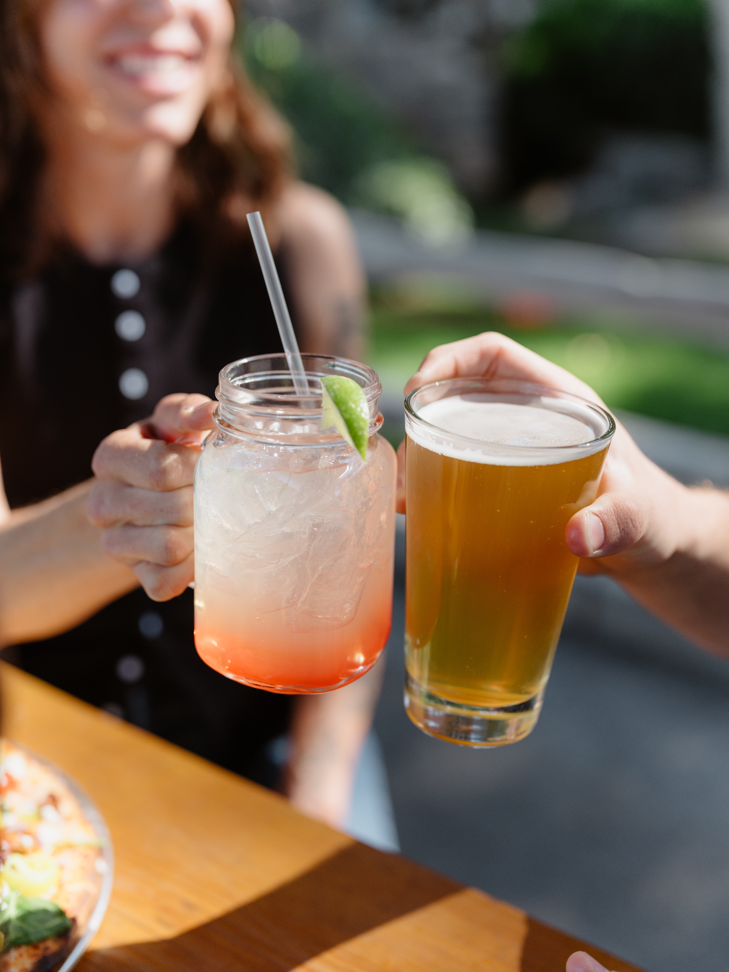 Cheers with a cocktail and a beer