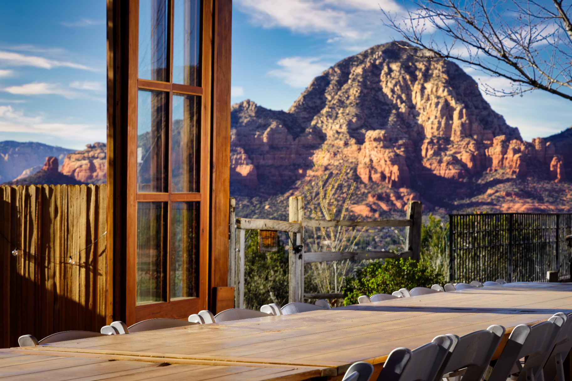 Outdoor dining table beside panoramic red rock views