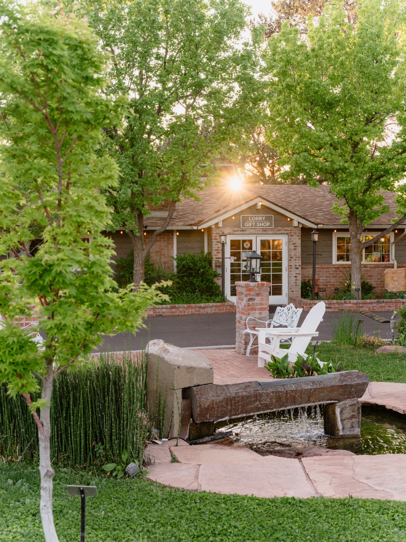 Lobby and gift shop entrance with fountain at sunset