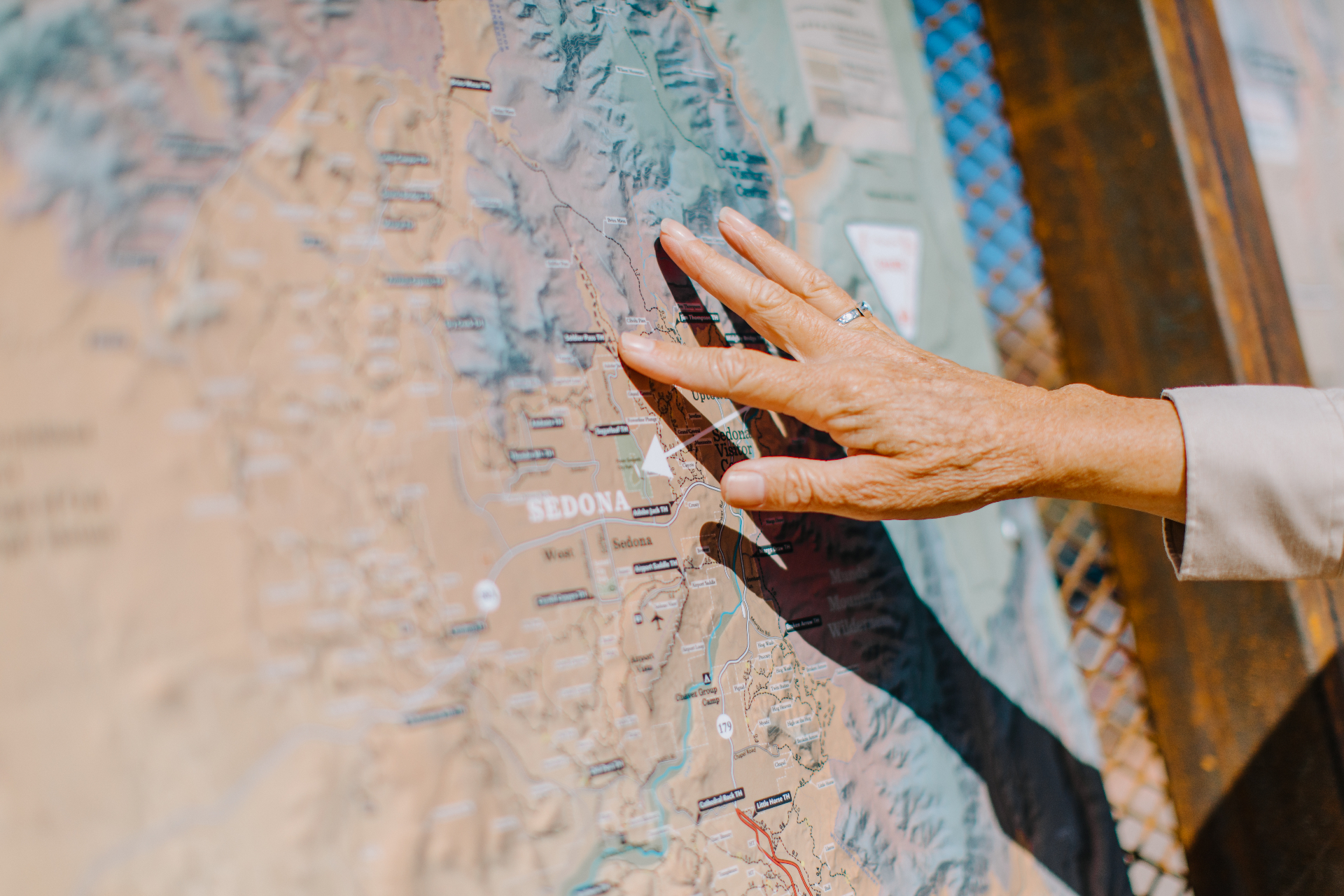 Hand pointing at a map of Sedona, Arizona