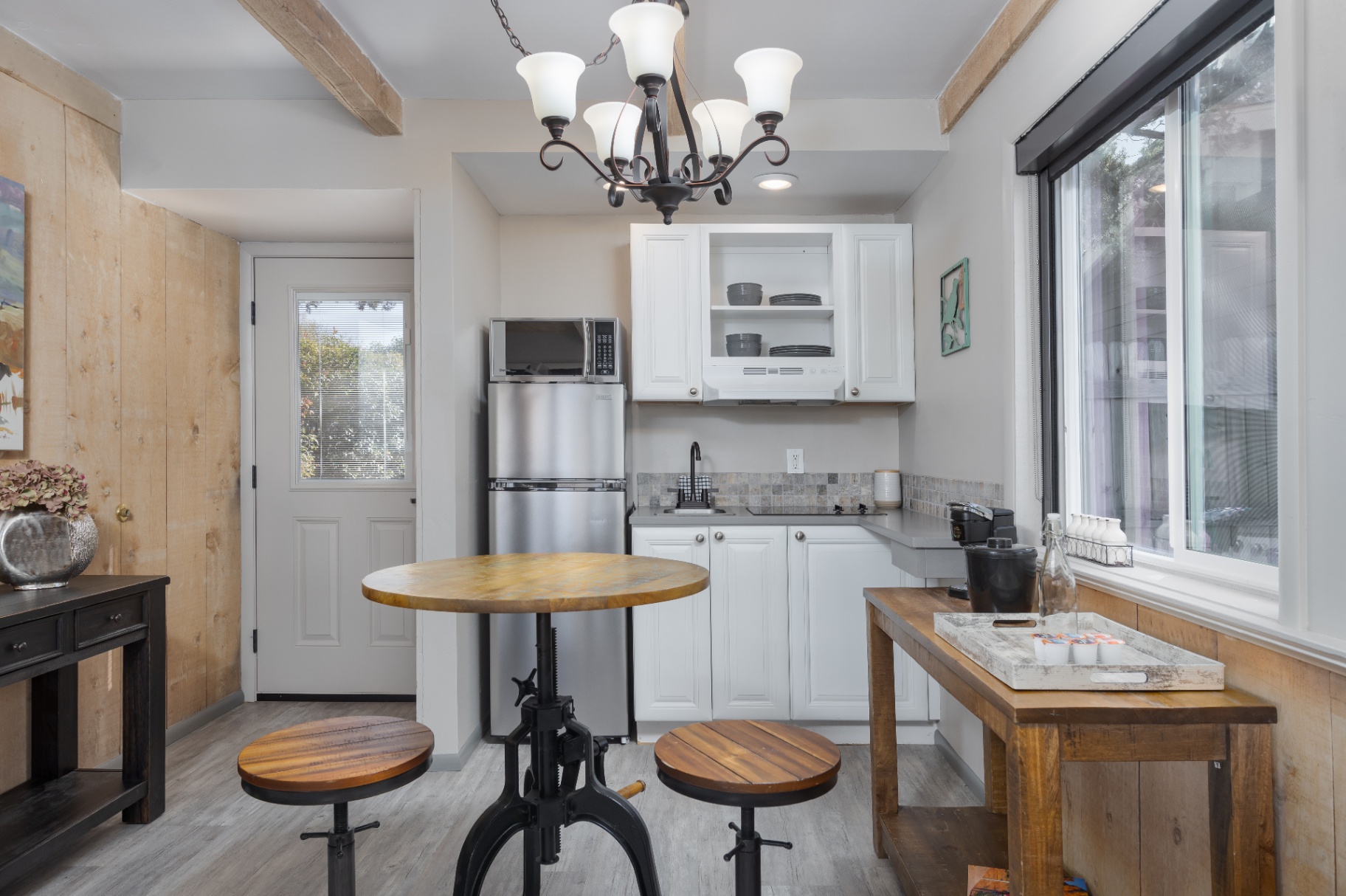 Cottage kitchenette with bistro table and chandelier